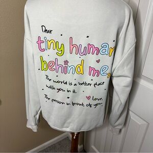 Cream Sweatshirt with Colorful Text Design “The World is a Better Place” 🐞